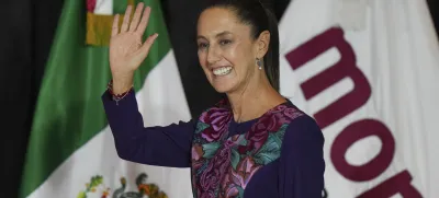 Ruling party presidential candidate Claudia Sheinbaum greets supporters after the National Electoral Institute announced she held an irreversible lead in the election in Mexico City, early Monday, June 3, 2024. (AP Photo/Fernando Llano)