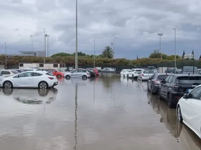 Vehicles parked in a flooded car park after heavy rains, at Palma de Mallorca airport, in Palma de Mallorca, Spain June 11, 2024, in this picture obtained from social media. Carmen Estaban Sanchez/via REUTERS THIS IMAGE HAS BEEN SUPPLIED BY A THIRD PARTY. MANDATORY CREDIT. NO RESALES. NO ARCHIVES.