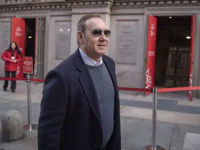 Actor Kevin Spacey leaves the National Museum of Cinema in Turin, Italy, Friday, Jan. 13, 2023. Kevin Spacey is scheduled to teach a class and being given an award at the National Museum of Cinema in Turin next Jan. 16. (Marco Alpozzi/LaPresse via AP)
