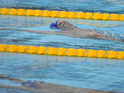Winner Apostolos Christou of Greece competes during the men's 50m backstroke final at the European Aquatics Championships in Belgrade, Serbia, Friday, June 21, 2024. (AP Photo/Darko Bandic)