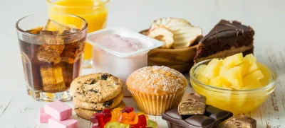 Selection of food high in sugar, copy space