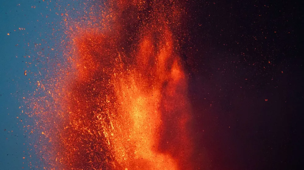 Lava rises from a crater of Mount Etna, Europe's most active volcano, Italy July 7, 2024. REUTERS/Etna Walk/Marco Restivo