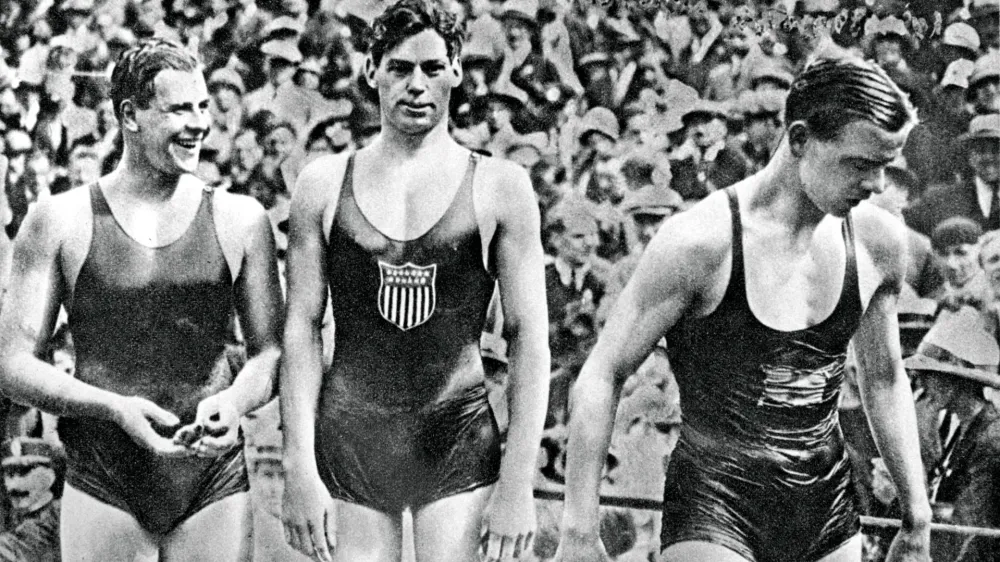 (L-R) The medallists: Australia's Andrew Charlton (bronze), USA's Johnny Weissmuller (gold) and Sweden's Arne Borg (silver)No Use UK. No Use Ireland. No Use Belgium. No Use France. No Use Germany. No Use Japan. No Use China. No Use Norway. No Use Sweden. No Use Denmark. No Use Holland