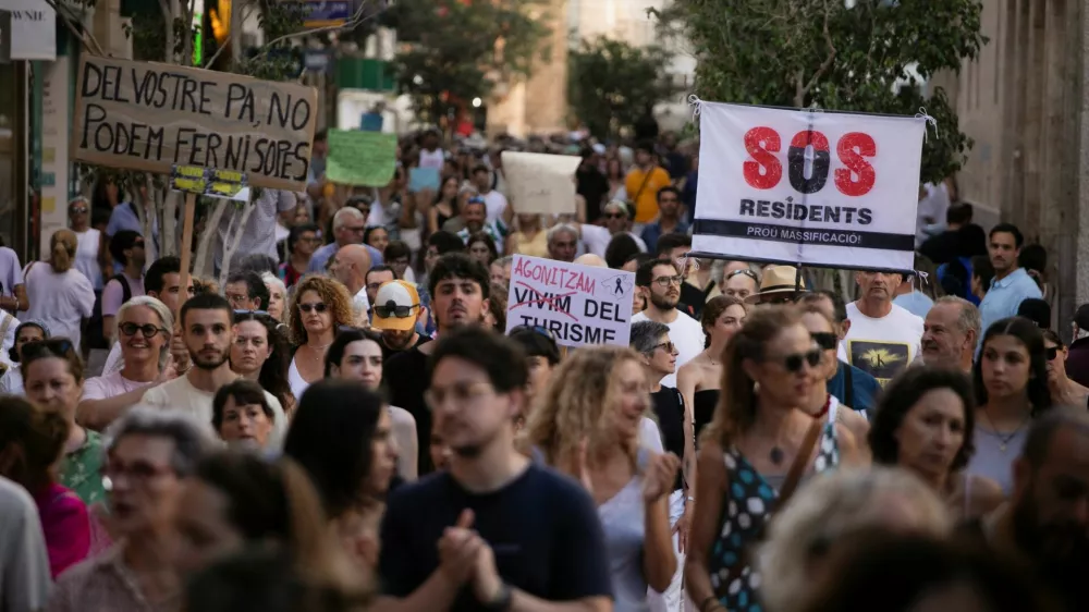 People take part in a protest against mass tourism in Palma de&nbsp;Mallorca, Spain, July 21, 2024. REUTERS/Stringer
