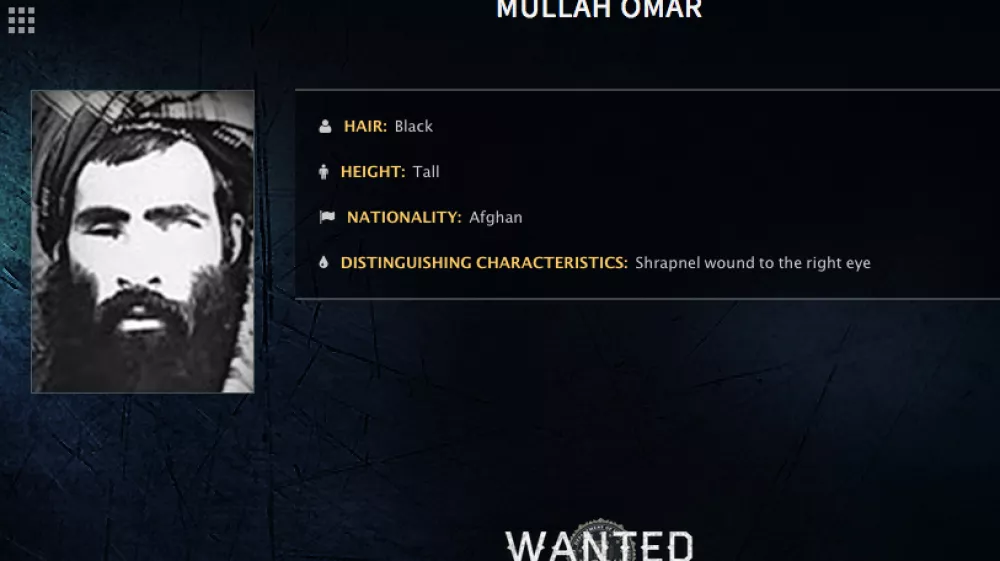 FILE - In this undated image released by the FBI, Mullah Omar is seen in a wanted poster. An Afghan official says his government is examining claims that reclusive Taliban leader Mullah Omar is dead. The Taliban could not be immediately reached for comment on the government?s comments about Omar, who has been declared dead many times before. (FBI via AP, File)