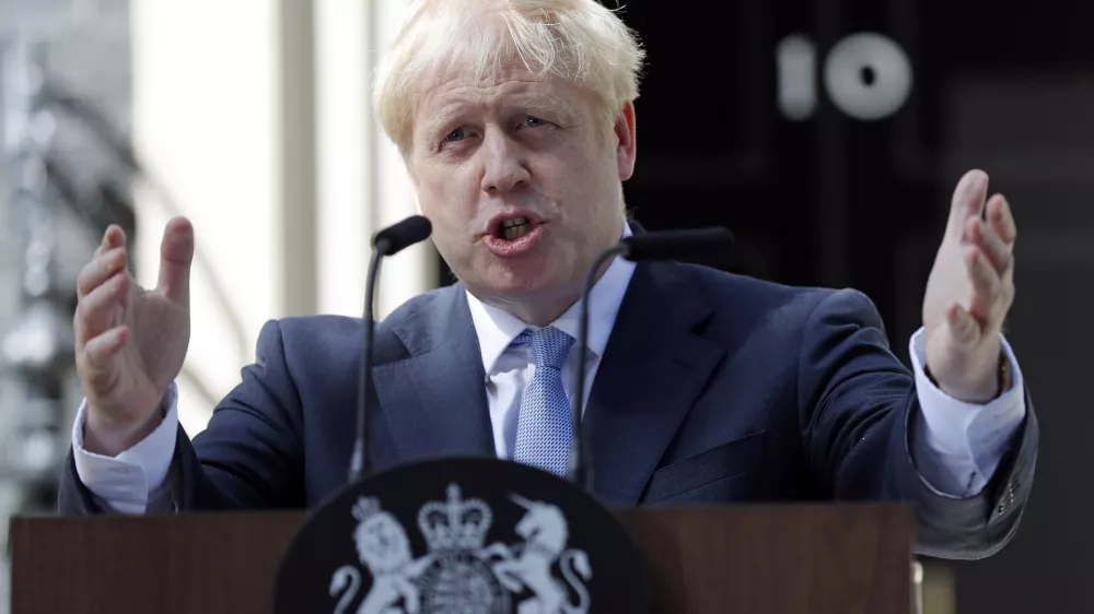 FILE - In this file photo dated Wednesday, July 24, 2019, Britain's newly installed Prime Minister Boris Johnson gestures as he speaks outside 10 Downing Street in London. The Brexit decision to split from the European Union was fuelled by a sense that the U.K. is fundamentally separate from its continental neighbours, and leading Brexit campaigner Boris Johnson once compared the EU to the conquests of Napoleon and Hitler. (AP Photo/Frank Augstein, FILE)