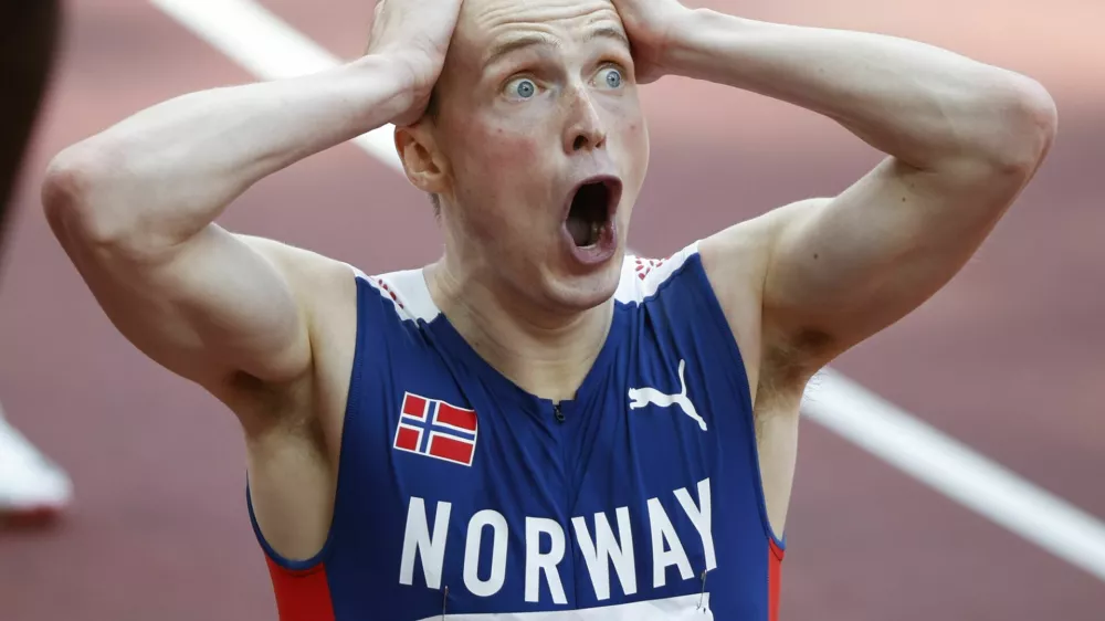 Tokyo 2020 Olympics - Athletics - Men's 400m Hurdles - Final - Olympic Stadium, Tokyo, Japan - August 3, 2021. Karsten Warholm of Norway reacts after realizing he had set a new world record. REUTERS/Phil Noble