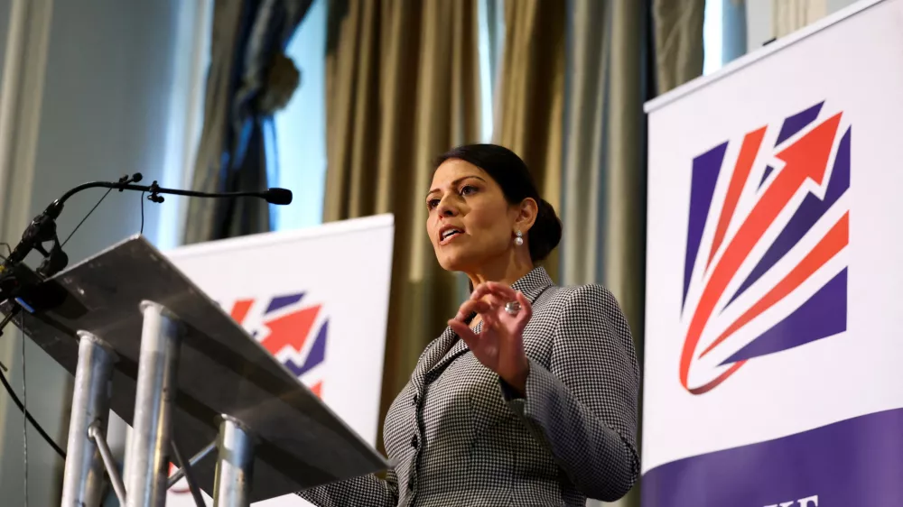 FILE PHOTO: Priti Patel speaks on stage at the Britain's Conservative Party's annual conference in Manchester, Britain, October 2, 2023. REUTERS/Hannah McKay/File Photo
