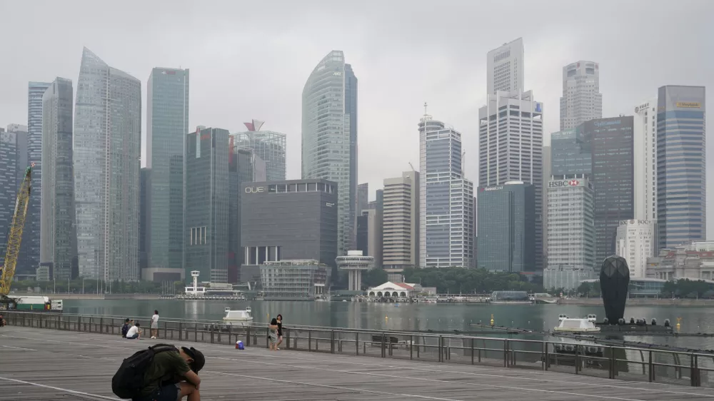 FILE - A man takes a nap as the central business district is shrouded by haze in Singapore, on Sept. 23, 2019. Singapore executed a man Wednesday, July 26, 2023, for drug trafficking and is set to hang a woman Friday &mdash; the first in 19 years &mdash; prompting renewed calls for a halt to capital punishment. (AP Photo/Vincent Thian, File)