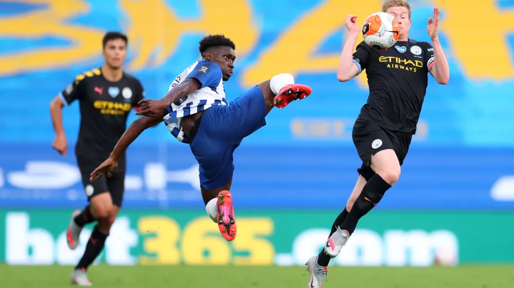 11 July 2020, England, Brighton: Brighton and Hove Albion's Yves Bissouma (L) challenges Manchester City's Kevin De Bruyne during the English Premier League soccer match between Brighton & Hove Albion and Manchester City at the Amex Stadium. Photo: Catherine Ivill/Nmc Pool/PA Wire/dpa