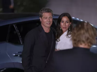 Brad Pitt, left, and Ines de Ramon pose for photographers upon arrival for the premiere of the film 'Wolfs' during the 81st edition of the Venice Film Festival in Venice, Italy, on Sunday, Sept. 1, 2024. (Photo by Vianney Le Caer/Invision/AP)