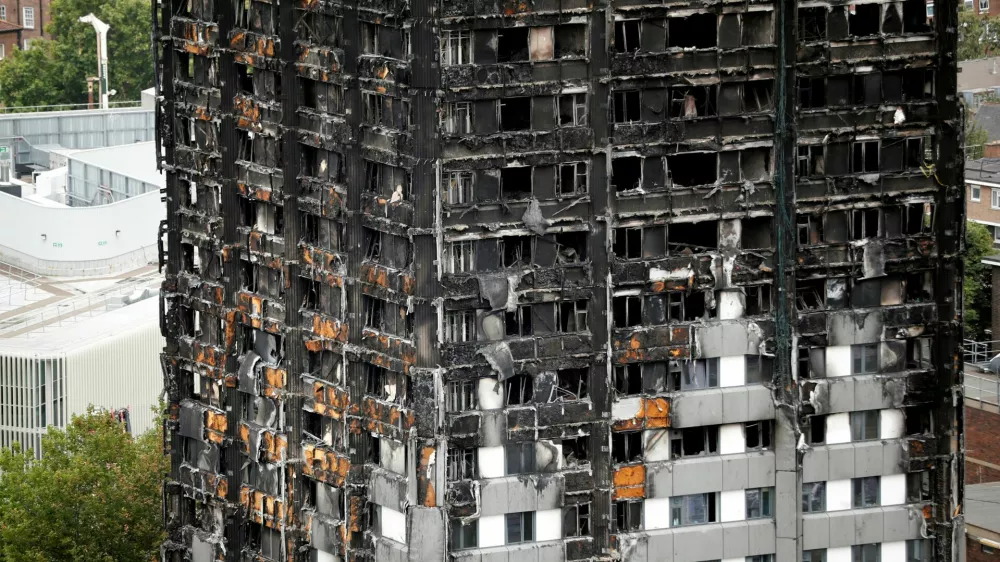 FILE PHOTO: A general view shows the Grenfell Tower, which was destroyed in a fatal fire, in London, Britain July 15, 2017. REUTERS/Tolga Akmen/File Photo