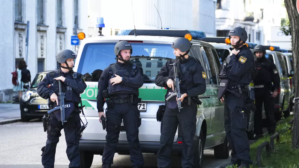 Police officers patrol after police fired shots at a suspicious person near the Israeli Consulate and a museum on the city's Nazi-era history in Munich, Germany, Thursday, Sept. 5, 2024. (AP Photo/Matthias Schrader)
