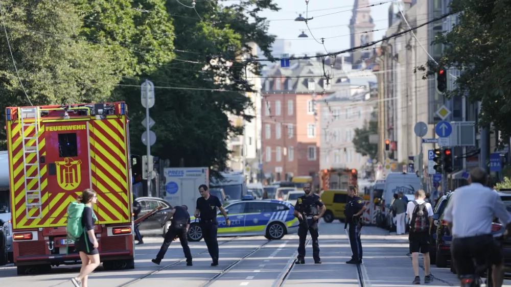 Police officers block a street after police fired shots at a suspicious person near the Israeli Consulate and a museum on the city's Nazi-era history in Munich, Germany, Thursday, Sept. 5, 2024. (AP Photo/Matthias Schrader)