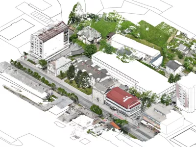 Garažno hi&scaron;o bi občina zgradila za stavbo, kjer deluje banka in je zdaj makadamsko parkiri&scaron;če. Foto:&nbsp;&nbsp;Občina Jesenice