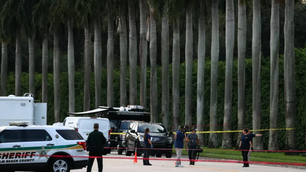 Law enforcement officers work after reports of shots fired outside Republican presidential nominee and former U.S. President Donald Trump's Trump International Golf Course in West Palm Beach, Florida, U.S. September 15, 2024. REUTERS/Marco Bello