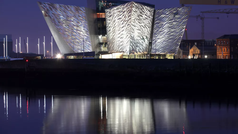 In this photo dated March 25 2012, the Titanic House Vistor Centre is reflected on Belfast Lough, Northern Ireland.  The Ł100 million (119.5 million euros; $158 million dollars) building is now finished and will open to the public on March 31. The world's biggest Titanic visitor attraction is to open in its Belfast birthplace later this month and it is 100 years to the day since the doomed ocean liner was completed in the same shipyard, Harland and Wolff. Northern Ireland hopes the eye-catching building will boost the tourism economy. (AP Photo/Peter Morrison)