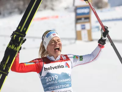 06 March 2021, Bavaria, Oberstdorf: Norway's Therese Johaug celebrates as she crosses the finish line to win the Women's Mass Start 30km Classic cross country race at the FIS Nordic Ski World Championships. Photo: Karl-Josef Hildenbrand/dpa