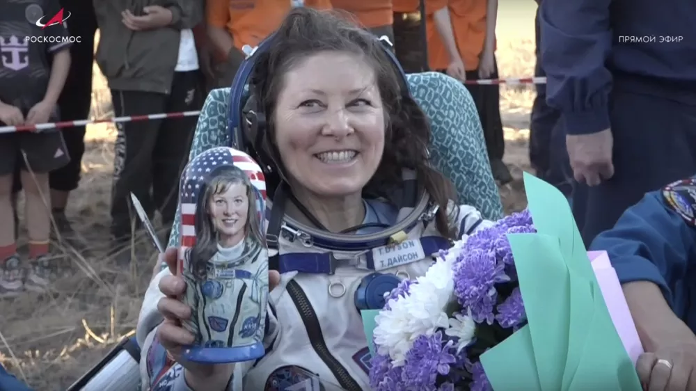 In this photo taken from video released by Roscosmos space corporation, the NASA astronaut Tracy Dyson holds a Russian traditional Matryoshka wooden doll depicting her shortly after the landing of the Russian Soyuz MS-25 space capsule carrying the NASA astronaut Tracy Dyson and the Roscosmos cosmonauts Oleg Kononenko and Nikolai Chub, south-east of the Kazakh town of Zhezkazgan, Kazakhstan, Monday, Sept. 23, 2024. (Roscosmos space corporation via AP)