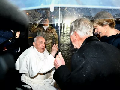 Pope Francis is welcomed by Belgian King Philippe and Queen Mathilde as he arrives at Melsbroek Military Air Base for a four-day apostolic journey, in Steenokkerzeel, Belgium, September 26, 2024. Vatican Media/&shy;Handout via REUTERS  ATTENTION EDITORS - THIS IMAGE WAS PROVIDED BY A THIRD PARTY.