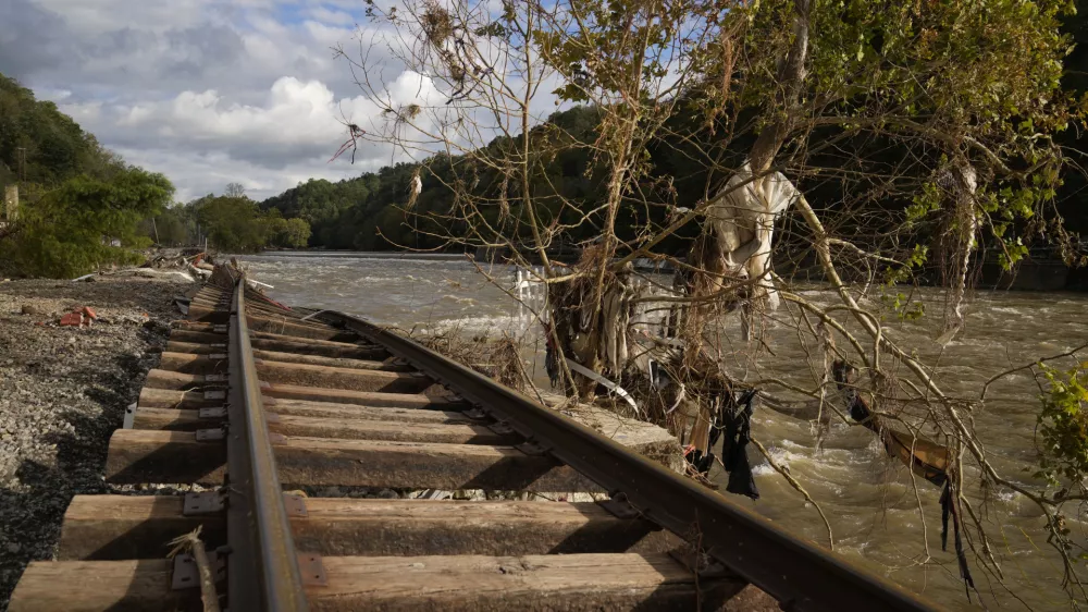 Train tracks washed out during Hurricane Helene run along the French Broad River, Tuesday, Oct. 1, 2024, in Marshall, N.C. (AP Photo/Jeff Roberson)