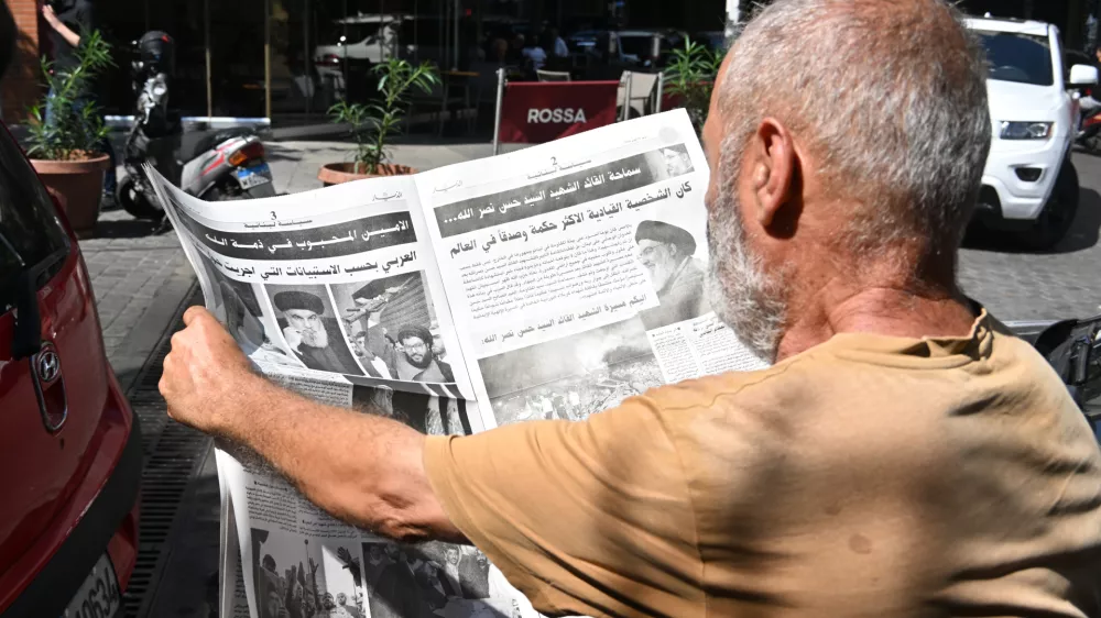 BEIRUT, LEBANON - SEPTEMBER 29: People read the news about the death of Hezbollah's Secretary-General Hassan Nasrallah, who lost his life after Israeli army's airstrike which was carried out by F-35 fighter jets, on newspapers in Beirut, Lebanon on September 29, 2024. Houssam Shbaro / AnadoluNo Use USA No use UK No use Canada No use France No use Japan No use Italy No use Australia No use Spain No use Belgium No use Korea No use South Africa No use Hong Kong No use New Zealand No use Turkey