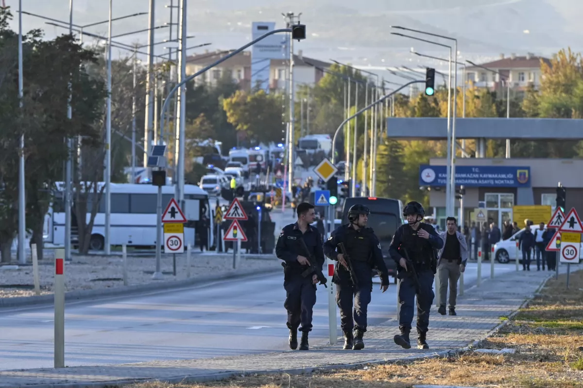 Emergency and security teams are deployed outside of Turkish Aerospace Industries Inc. at the outskirts of Ankara, Turkey, Wednesday, Oct. 23, 2024. (AP Photo/Mert Gokhan Koc)