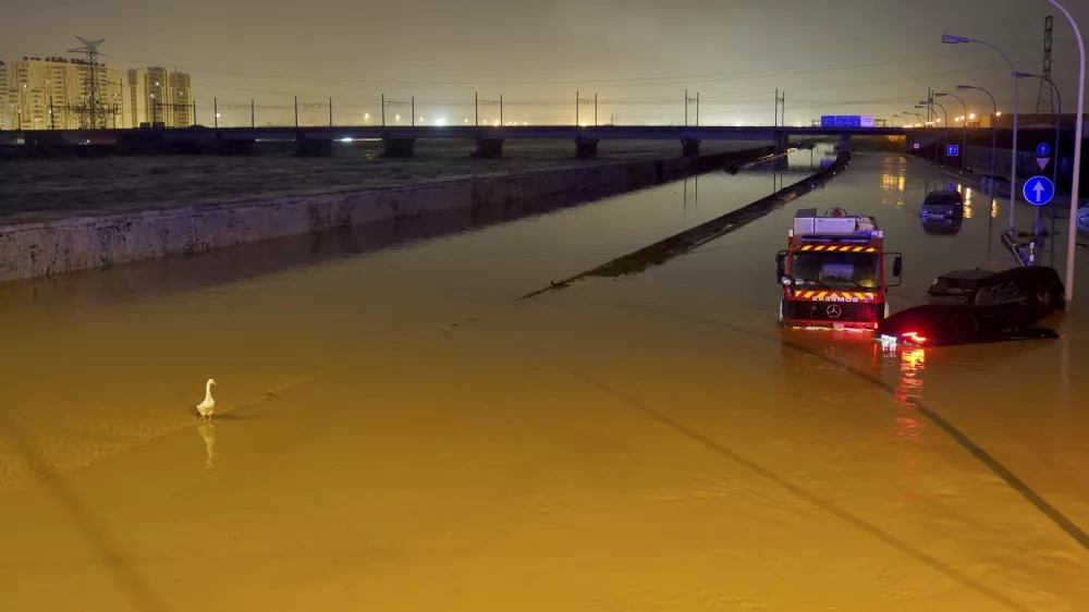 Cars are trapped by flooding in Valencia, Wednesday, Oct. 30, 2024. (AP Photo/Alberto Saiz)