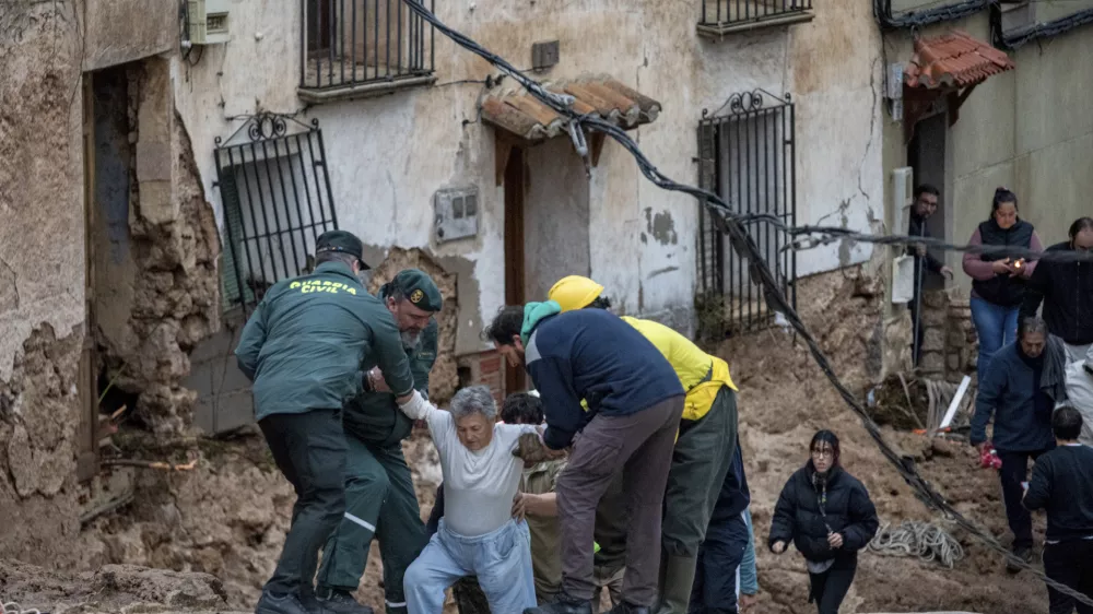 Members of emergency services and Guardia Civil rescue people trapped in their homes after floods in Letur, Albacete, Tuesday, Oct. 29, 2024. (V&iacute;ctor Fern&aacute;ndez/Europa Press via AP)