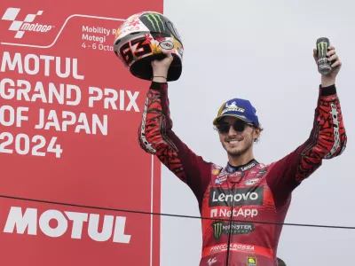 First place Italian rider Francesco Bagnaia of&nbsp;Ducati Lenovo Team celebrates during awards ceremony for the MotoGP race at the Twin Ring Motegi circuit in Motegi, north of Tokyo, Japan, Sunday, Oct. 6, 2024, (AP Photo/Hiro Komae)