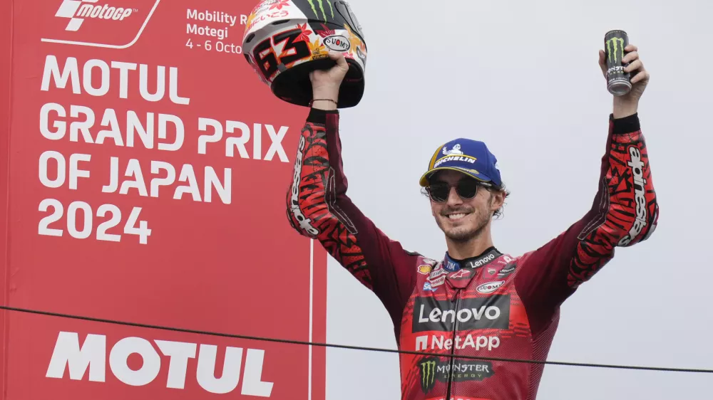 First place Italian rider Francesco Bagnaia of&nbsp;Ducati Lenovo Team celebrates during awards ceremony for the MotoGP race at the Twin Ring Motegi circuit in Motegi, north of Tokyo, Japan, Sunday, Oct. 6, 2024, (AP Photo/Hiro Komae)