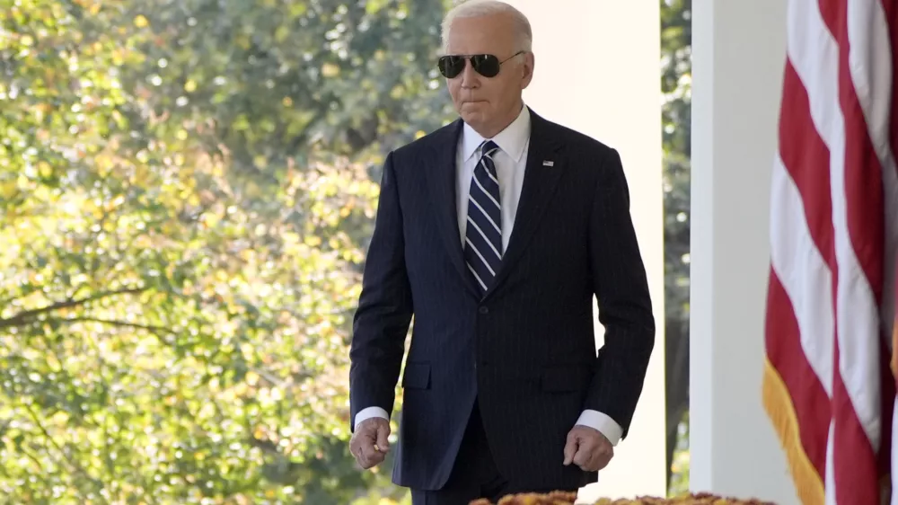 President Joe Biden walks to speak in the Rose Garden of the White House in Washington, Thursday, Nov. 7, 2024. (AP Photo/Mark Schiefelbein)