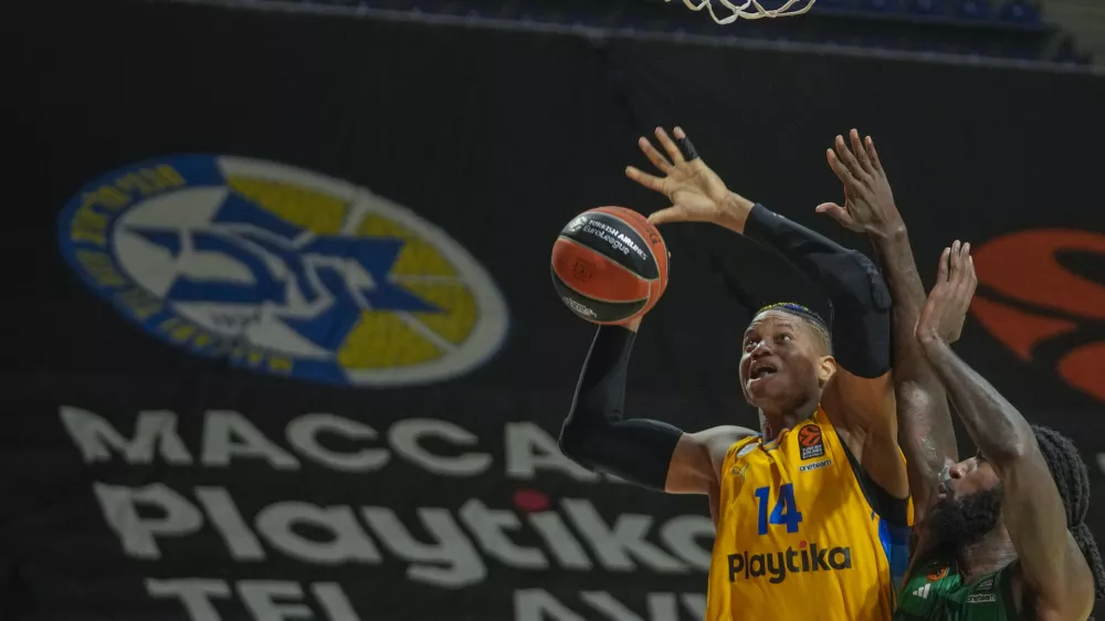 FILE - Maccabi's Jasiel Rivero, left,&nbsp;tries to score as&nbsp;Panathinaikos' Mathias Lessort blocks him during the Euroleague basketball match between Maccabi Tel Aviv and Panathinaikos in Belgrade, Serbia, Thursday, May 2, 2024. (AP Photo/Darko Vojinovic, File)
