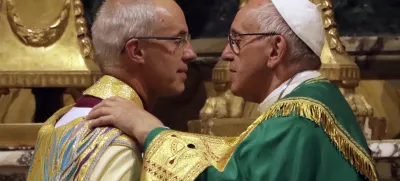 Pope Francis, right, greets the archbishop of Canterbury, Justin Welby, during vespers prayers in the church of San Gregorio al Celio, in Rome, Wednesday, Oct. 5, 2016. Francis joined the archbishop of Canterbury, Justin Welby, for a vigil prayer service Wednesday at Rome's church of St. Gregory. The church is named for the 6th century pope who dispatched missionaries to England to spread Christianity. (AP Photo/Gregorio Borgia)