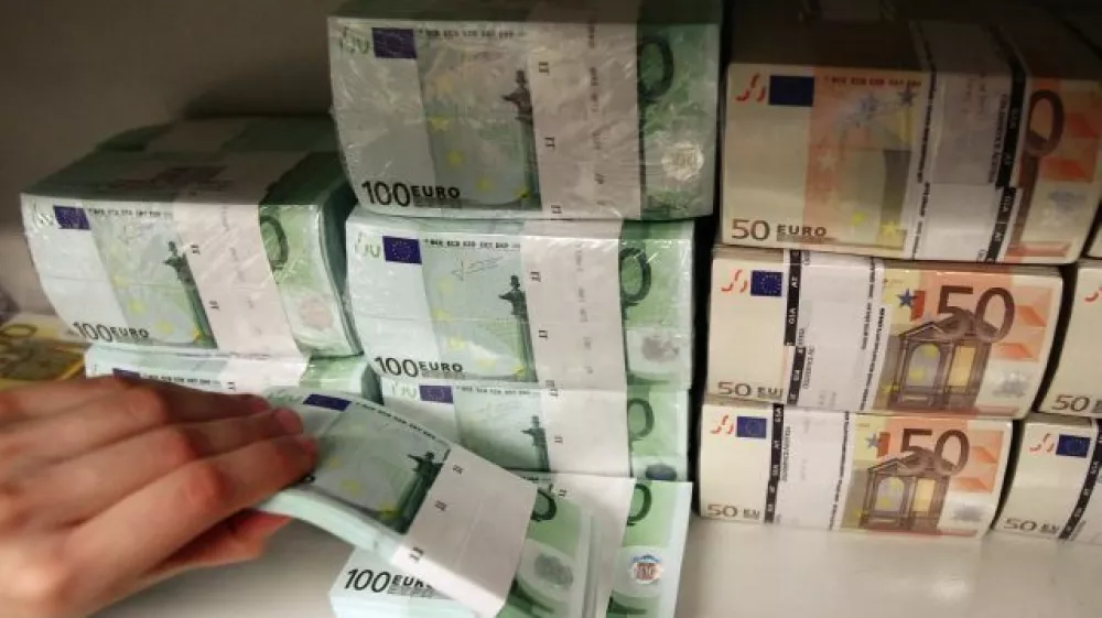 Euro bills are pictured in the safe of an Austrian bank in Vienna April 10, 2013. Austrian Finance Minister Maria Fekter will fight "like a lion" to defend the country's banking secrecy, she told a newspaper on Monday, promising to veto any steps that endanger the centuries-old tradition. Austria taxes interest income at source and sends the proceeds back to the depositor's home country without revealing any names, a system it defends as being more efficient than exchanging personal information with foreign governments. REUTERS/Heinz-Peter Bader (AUSTRIA - Tags: BUSINESS)