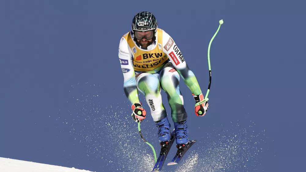 Slovenia's Bostjan Kline speeds down the course during an alpine ski, men's World Cup downhill race, in Wengen, Switzerland, Friday, Jan. 14, 2022. (AP Photo/Gabriele Facciotti)