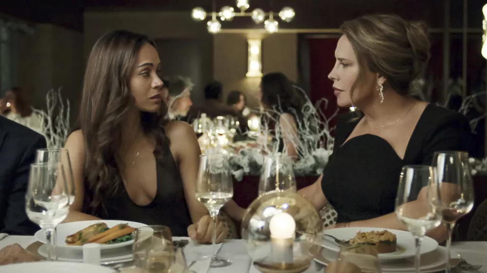 This image released by Netflix shows Karla Sof&iacute;a Gasc&oacute;n, right, and Zoe Salda&ntilde;a in a scene from "Emilia P&eacute;rez." (Shanna Besson/Netflix via AP)