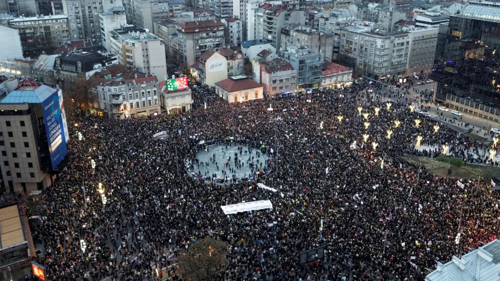 A drone view shows people gathering during a protest against government policies, corruption and the negligence which they blame for the deaths of the victims in the Novi Sad railway station disaster in November, in Belgrade, Serbia, December 22, 2024. REUTERS/Djordje Kojadinovic