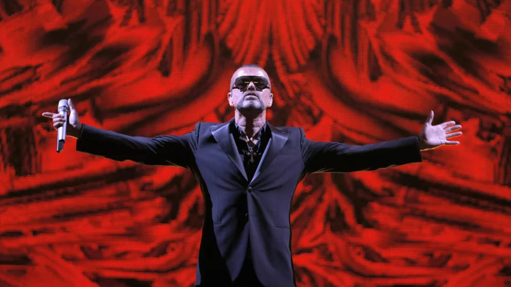 FILE - In this Sept. 9, 2012 file photo, British singer George Michael performs at a concert to raise money for the AIDS charity Sidaction, during the Symphonica tour at Palais Garnier Opera house in Paris, France. Michael, who rocketed to stardom with WHAM! and went on to enjoy a long and celebrated solo career lined with controversies, has died, his publicist said Sunday, Dec. 25, 2016. He was 53. (AP Photo/Francois Mori, File)