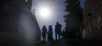 Worshippers walk down the stairs next to the Christmas morning Mass at the Chapel of Saint Catherine, traditionally believed to be the birthplace of Jesus, in the West Bank city of Bethlehem, Wednesday, Dec. 25, 2024. (AP Photo/Matias Delacroix)