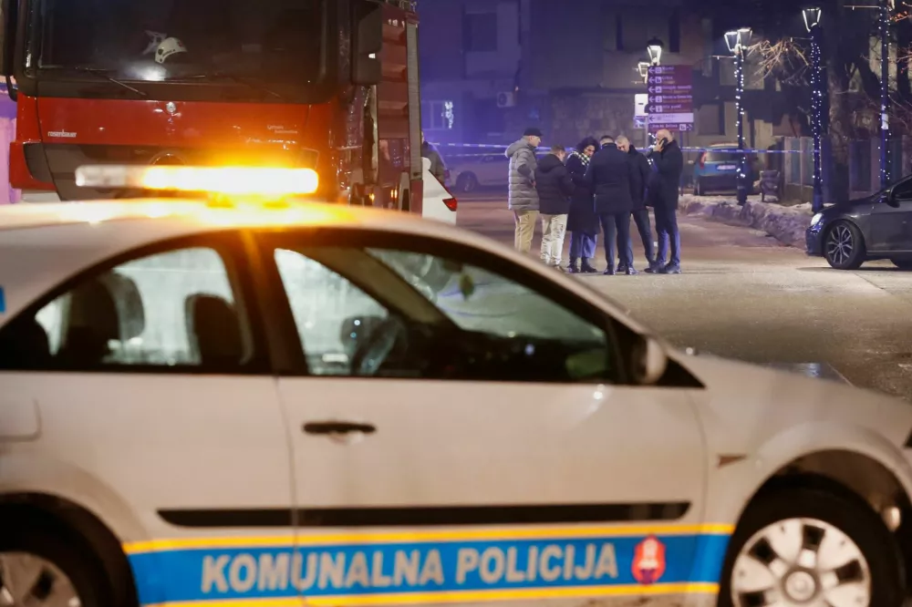 Police and security personnel stand on a street in front of a firetruck near the scene where a gunman opened fire at a restaurant and killed several people in Cetinje, Montenegro, January 1, 2025. REUTERS/Stevo Vasiljevic