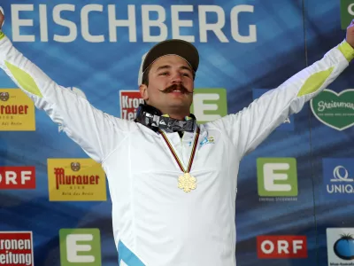 Slovenia's Filip Flisar celebrates his gold medal at the men's freestyle ski cross event at the Freestyle Ski and Snowboard World Championships in Kreischberg, Austria, Sunday, Jan. 25, 2015. (AP Photo/Darko Bandic)