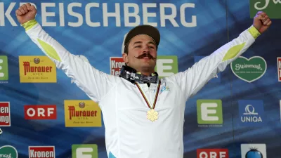 Slovenia's Filip Flisar celebrates his gold medal at the men's freestyle ski cross event at the Freestyle Ski and Snowboard World Championships in Kreischberg, Austria, Sunday, Jan. 25, 2015. (AP Photo/Darko Bandic)