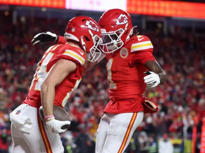 Jan 26, 2025; Kansas City, MO, USA; Kansas City Chiefs wide receiver Justin Watson (84) reacts with wide receiver Xavier Worthy (1) after making a catch for a two point conversion against the Buffalo Bills during the second half in the AFC Championship game at GEHA Field at Arrowhead Stadium. Mandatory Credit: Mark J. Rebilas-Imagn Images