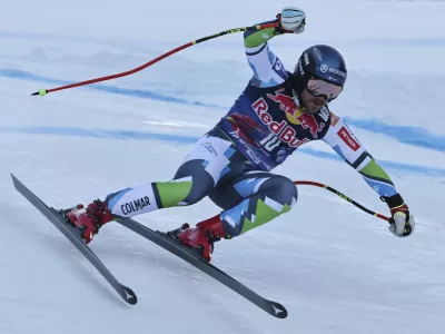 Slovenia's Miha Hrobat speeds down the course during an alpine ski, men's World Cup downhill, in Kitzb&uuml;hel, Austria, Saturday, Jan. 25, 2025. (AP Photo/Marco Trovati)