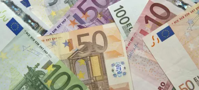 FILED - 03 January 2014, Hesse, Frankfurt/Main: Numerous euro banknotes lie on a table. The European Central Bank (ECB) has made a preliminary selection of designs intended for the planned new euro banknotes, including birds, rivers, buildings or famous figures such as Marie Curie and Leonardo da Vinci. Photo: Daniel Reinhardt/dpa