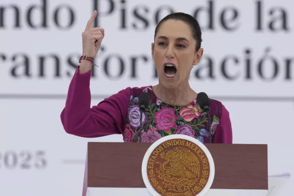 FILE - President Claudia Sheinbaum speaks to the crowd during an event marking her first 100 days in office, at the Z&oacute;calo, Mexico City's main square, in Mexico City, Sunday, Jan. 12, 2025. (AP Photo/Fernando Llano, File)