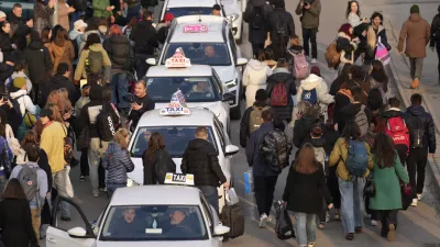 A taxi driver arrives to bring students back to Belgrade after a protest over the collapse of a concrete canopy that killed 15 people more than two months ago, in Novi Sad, Serbia, Sunday, Feb. 2, 2025. (AP Photo/Darko Vojinovic)