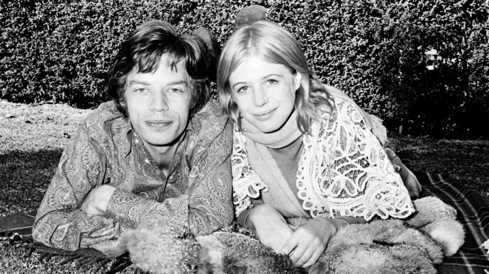 SYDNEY;AUSTRALIA - JULY 27: Mick Jagger and Marianne Faithfull in the gardens at Mount St Margaret Hospital, Sydney, July 27 1969. Marianne Faithfull is a patient at the hospital following a drug overdose. (Photo by George Lipman/The Sydney Morning Herald/Fairfax Media via Getty Images via Getty Images).