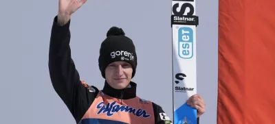 Lovro Kos of, Slovenia, celebrates his victory in the Men's Large Hill HS128 individual World Cup ski jumping competition, Saturday, Feb. 10, 2024, in Lake Placid, N.Y. (AP Photo/Robert F. Bukaty)
